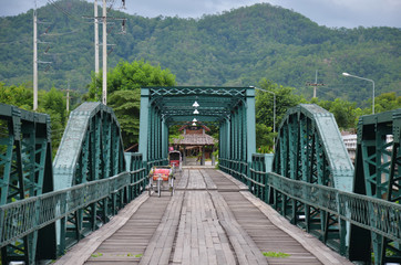 Tricycle thai style on Bridge over Pai River at Pai