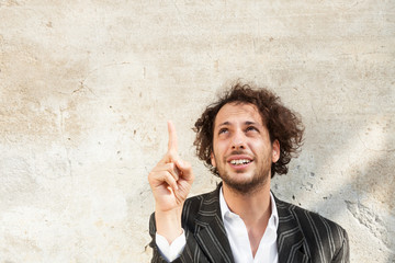 portrait of cheerful young man, wall background