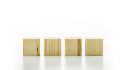 Four wooden cubes or building blocks