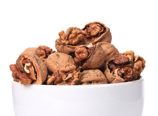 Close up of walnuts bunch in bowl.