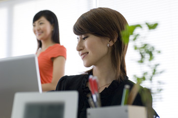 Two Japanese women in their twenties who pass in office