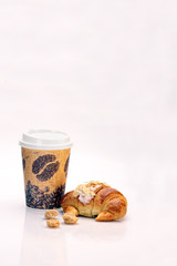 Coffee and Croissant with almond flakes
