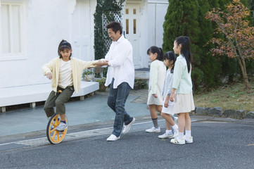 Japanese family playing outdoors © TAGSTOCK2