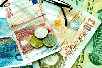 Banknotes: dollar, euro, british pound sterling, euro cents.