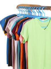 t-shirts hanging on hangers