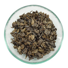 Green tea on glass saucer.