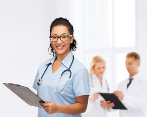 smiling female african american doctor or nurse