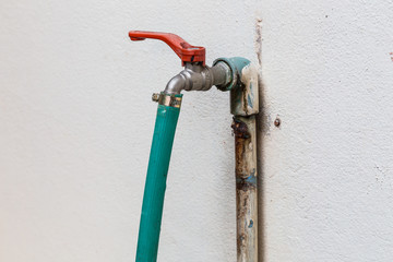 Faucet with rubber tube on the well