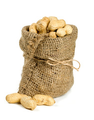 peanuts in a miniature burlap bag isolated on white