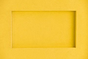 Yellow rectangular niche in concrete wall