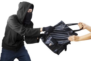 A thief stealing handbag