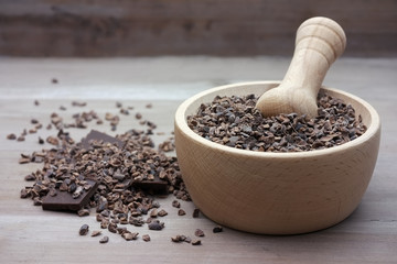 Cacao nibs crushed raw beans in pestle