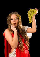 Ancient greece woman hands a bunch of grapes