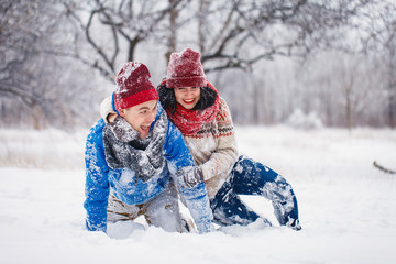 Guy and girl walk and have fun in the forest