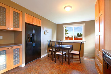 Modern maple kitchen with black appliances