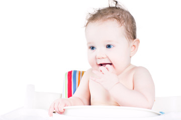 Funny laughing baby waiting for lunch