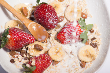 Pouring milk on cereal