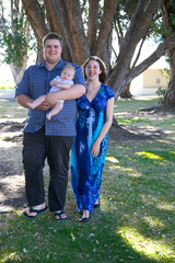 Young parents with their baby at the park.