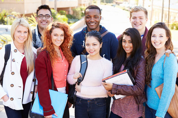 Portrait Of University Students Outdoors On Campus