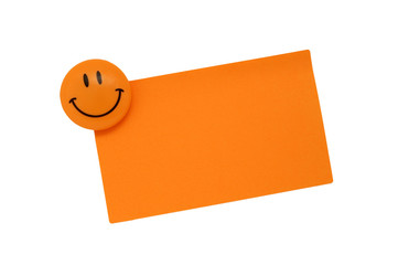 Blank note with smiling magnet isolated on white