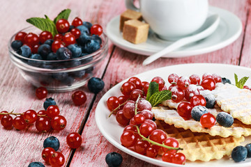waffles with berries on the table