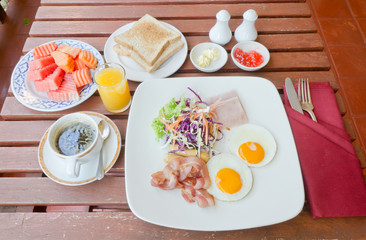 Fototapeta na wymiar set of american breakfast on wood table