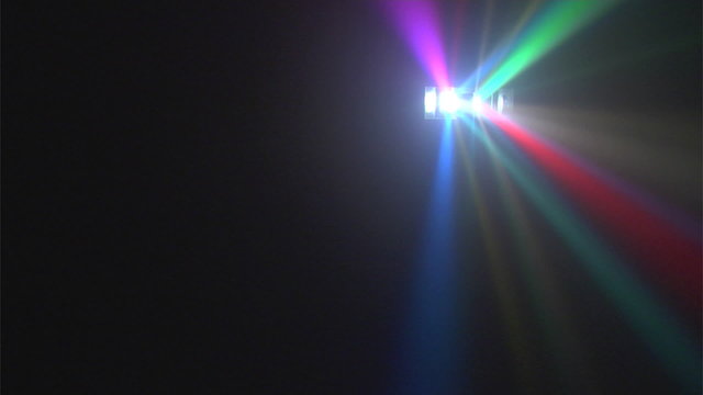 Multi colored disco lights in haze