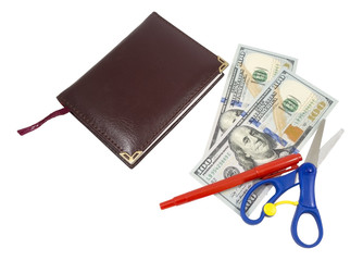 Notebook, pen, scissors and dollars