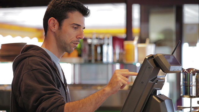 Man at cash register - close up