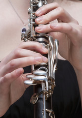 Obraz premium Hands of Female Musician Playing Clarinet
