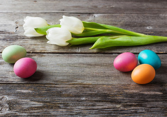 easter eggs with flowers  on wooden background