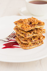 Slices of delicious fresh baked  apple cake on a wooden surface