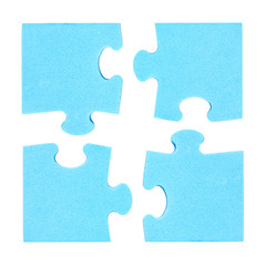 Four  puzzle pieces combined cooperation concept