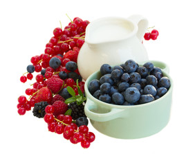 fresh berries with jug of  milk