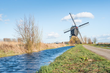 Dutch windmill in a polder landscape