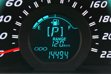 Close-up of a digital car fuel gauge