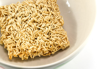 Dry instant noodle in a bowl