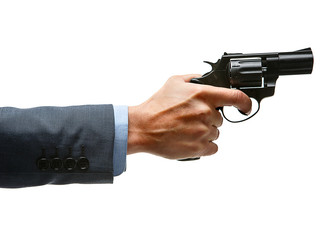 Male hand aiming revolver gun