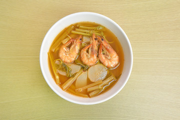 sour soup made of tamarind paste (Thai food) on a wooden table