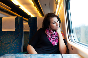 Young woman travelling by train - 61780176