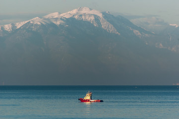 Red tugboat and Mt Olympus, Greece