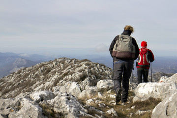Woman and man climbing ridge of Mosor mountain in Croatia