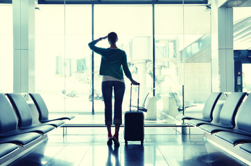 Fototapeta premium Girl at the airport window