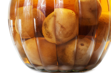 Obraz premium Vietnamese salted and pickled limes in a glass jar