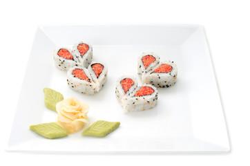 Sushi nicely decorated forming hearts  shapes on white square di
