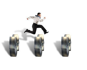 businessman jumping over money symbol obstacles