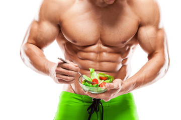 Shaped and healthy body man holding a fresh salad bowl,shaped ab - 61785524