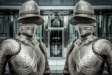 Medieval armor protecting a business building. Concept of firewa
