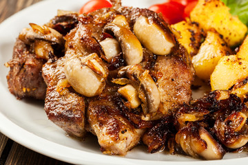 Fried pork chop with mushrooms and chips