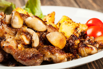 Fried pork chop with mushrooms and chips
